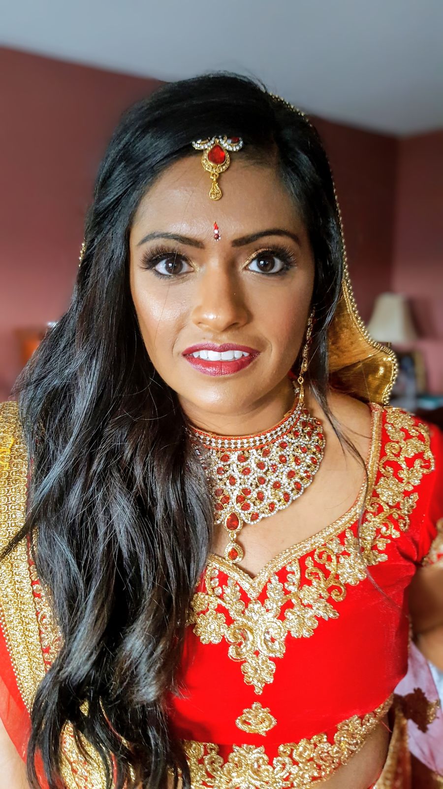 Bride in red with bridal jewellery